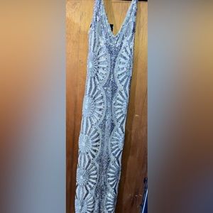 Silver Beaded Maxi Dress by Bella Barnett. Only worn once.Beautiful fitted gown.